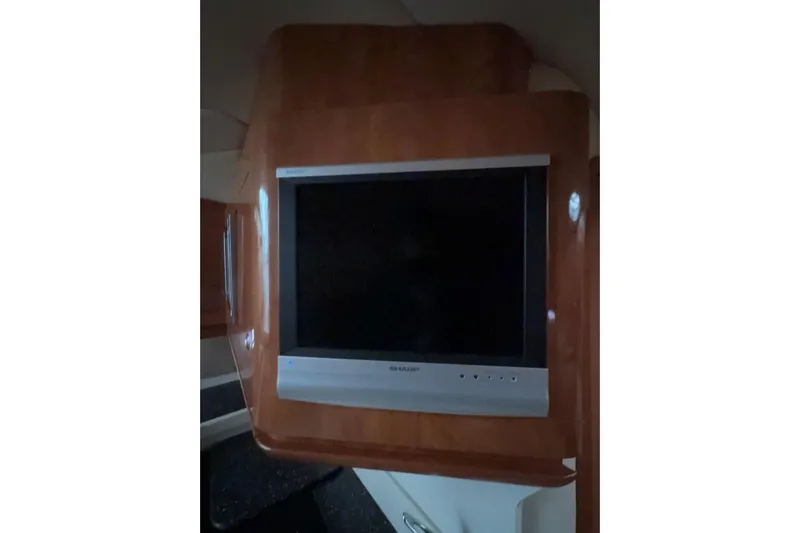  Yacht Photos Pics Flat-screen TV mounted on wood panel in 2007 Four Winns 378 Vista boat interior.