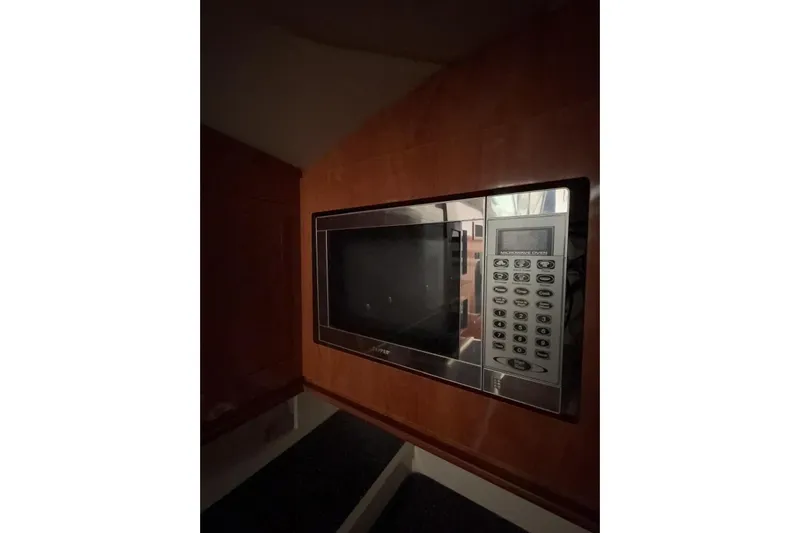  Yacht Photos Pics Built-in microwave in 2007 Four Winns 378 Vista yacht kitchen area.