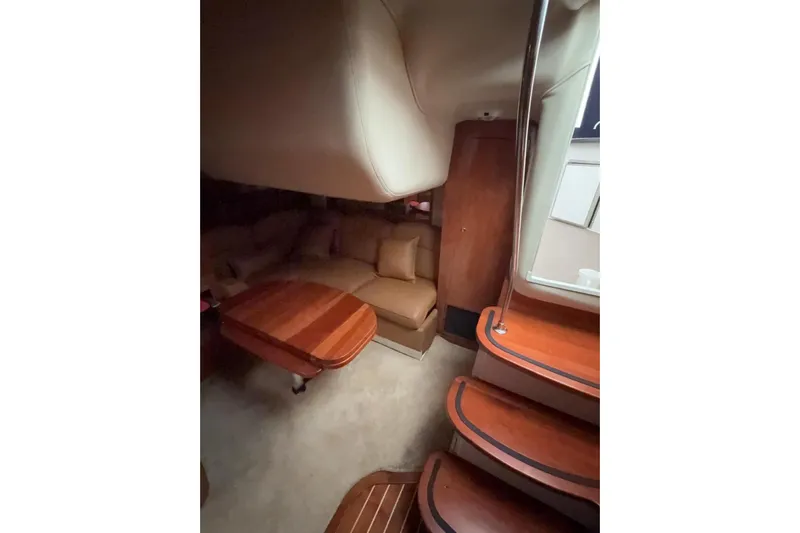  Yacht Photos Pics Interior of 2007 Four Winns 378 Vista yacht with wooden table and seating area.