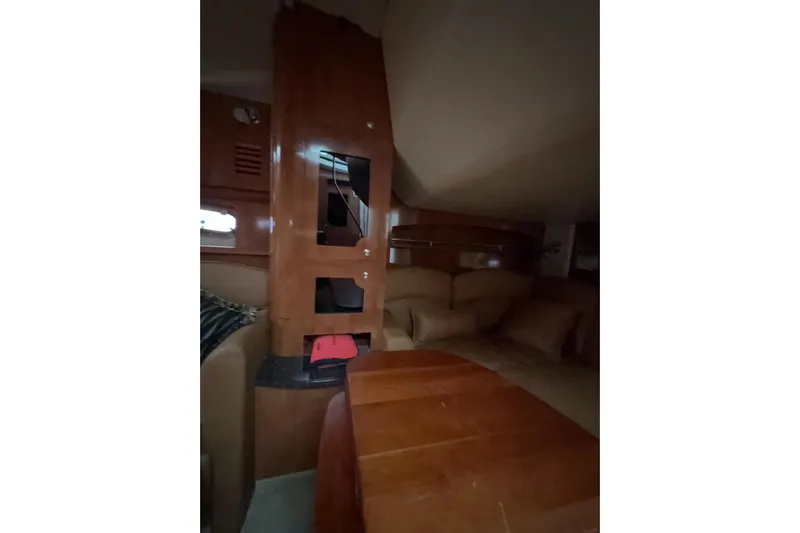  Yacht Photos Pics Interior of 2007 Four Winns 378 Vista yacht with wood cabinetry and seating area.