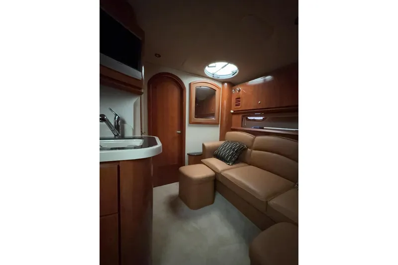  Yacht Photos Pics Luxurious interior of 2007 Four Winns 378 Vista yacht with leather seating and wood finishes.