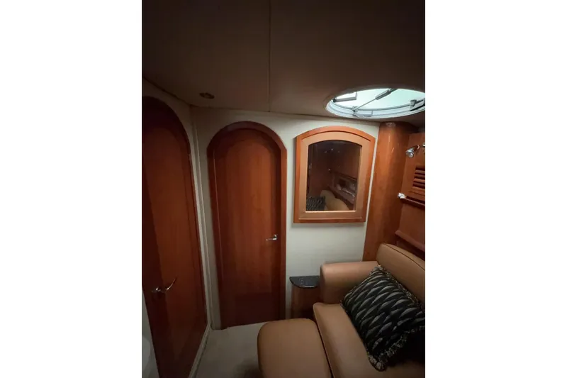  Yacht Photos Pics Interior of 2007 Four Winns 378 Vista yacht with wooden doors and seating area.