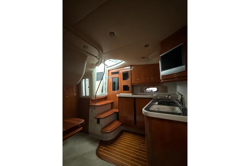  Yacht Photos Pics Interior of 2007 Four Winns 378 Vista yacht with wood cabinetry and modern amenities.