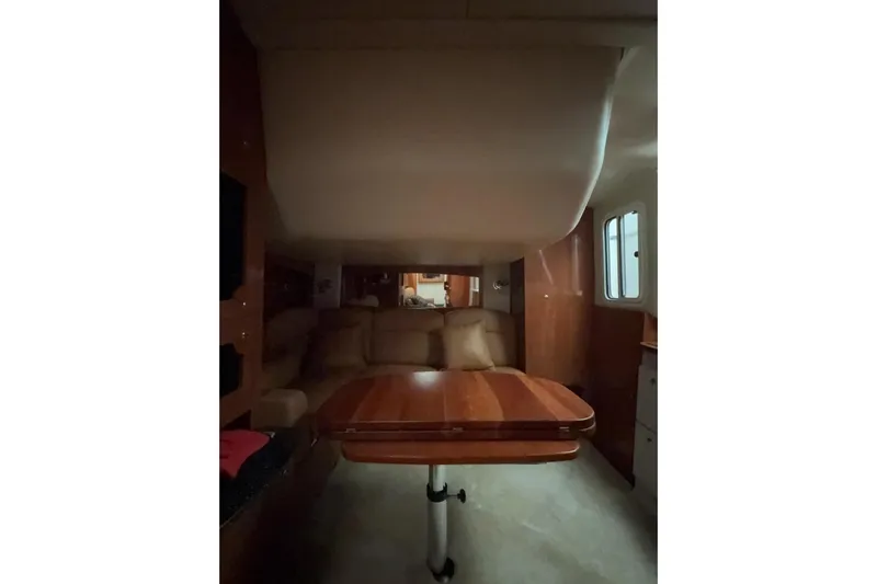  Yacht Photos Pics 2007 Four Winns 378 Vista cabin interior with wooden table and seating area.