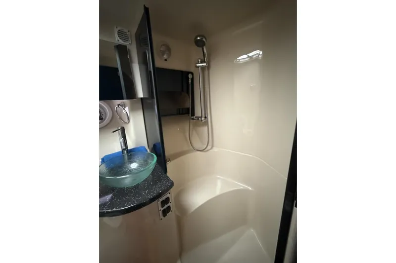  Yacht Photos Pics Luxurious bathroom in 2007 Four Winns 378 Vista yacht with modern fixtures and glass sink.