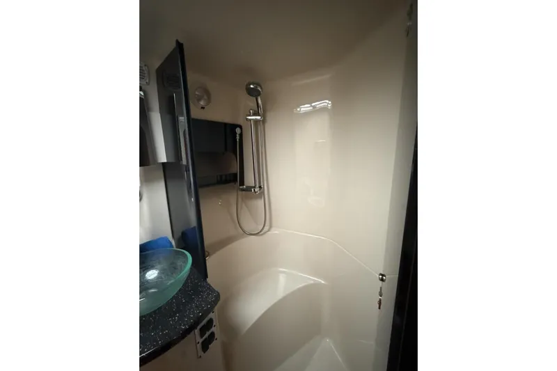  Yacht Photos Pics 2007 Four Winns 378 Vista yacht bathroom with modern shower and glass sink.