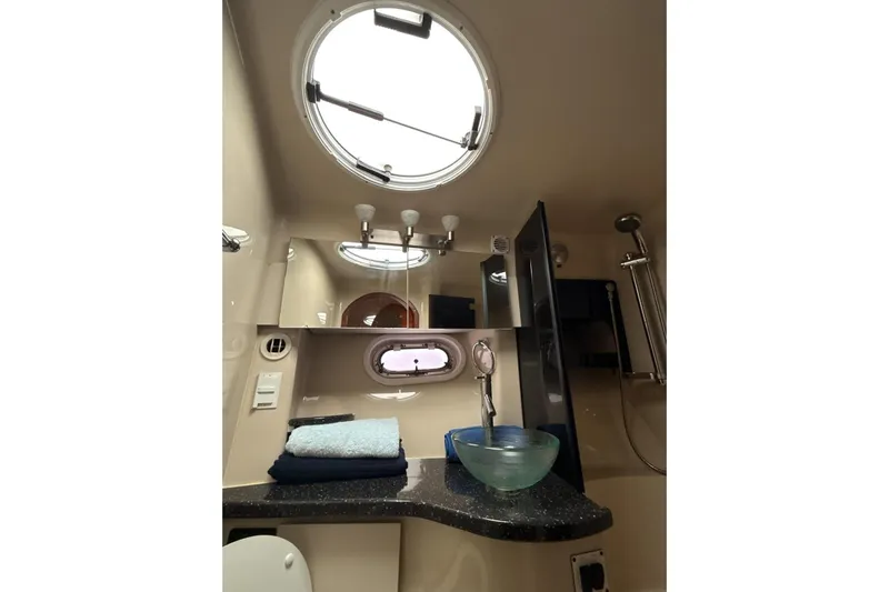  Yacht Photos Pics Luxurious bathroom interior of 2007 Four Winns 378 Vista yacht with modern fixtures.