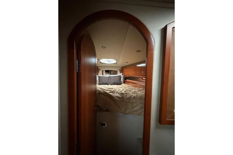  Yacht Photos Pics Cozy cabin interior of 2007 Four Winns 378 Vista yacht with wood finish.