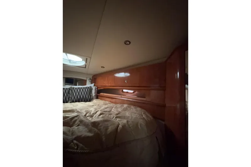  Yacht Photos Pics Luxurious cabin interior of 2007 Four Winns 378 Vista yacht with wood finish.