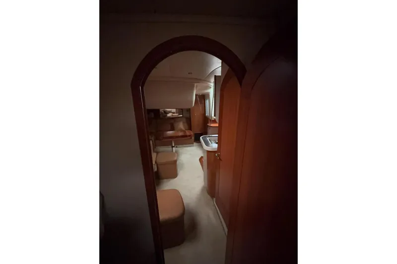  Yacht Photos Pics Interior view of 2007 Four Winns 378 Vista yacht, featuring cozy seating and wooden finishes.