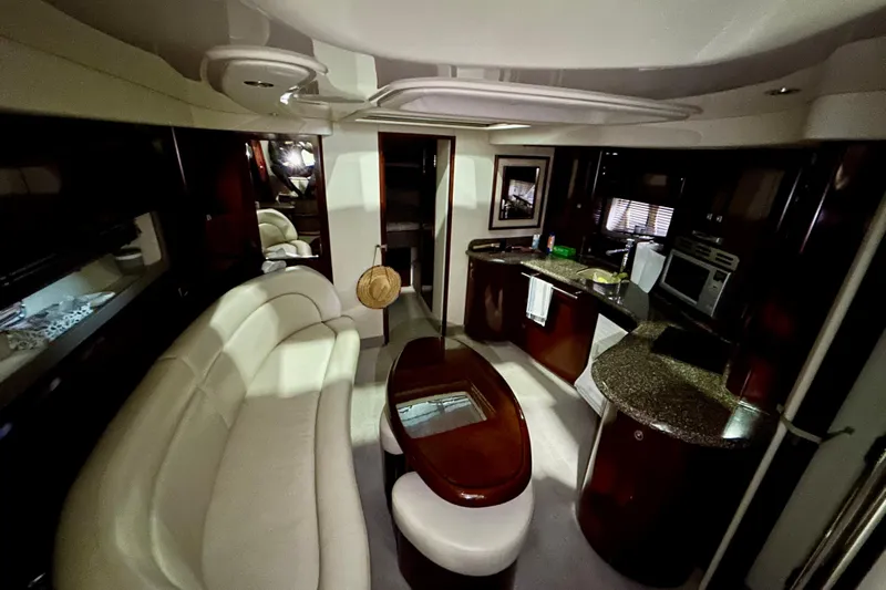  Yacht Photos Pics Luxurious interior of a 2008 Sea Ray 44 Sundancer yacht with elegant seating and modern kitchen.