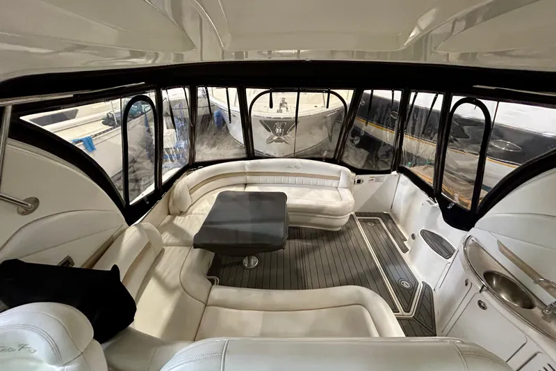  Yacht Photos Pics Interior of 2008 Sea Ray 44 Sundancer yacht with white seating and table.