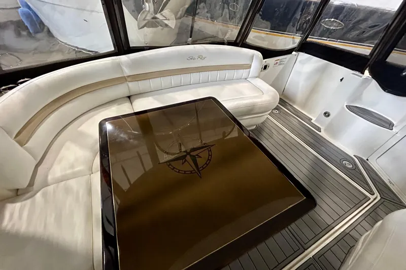  Yacht Photos Pics Luxurious interior of 2008 Sea Ray 44 Sundancer with elegant seating and sleek table design.