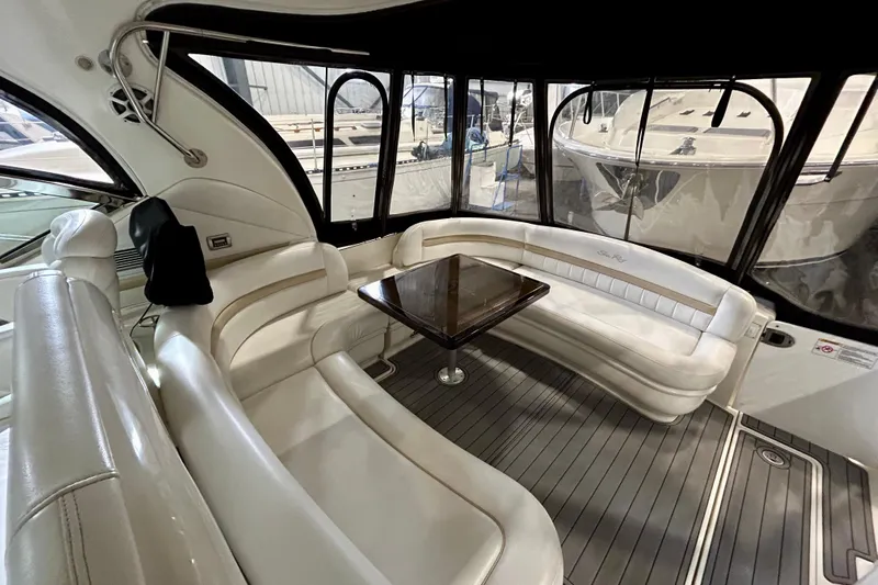  Yacht Photos Pics Luxurious interior of 2008 Sea Ray 44 Sundancer yacht with elegant seating and table.