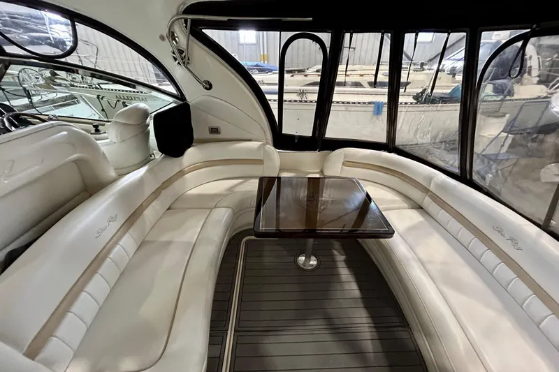  Yacht Photos Pics Luxurious interior of 2008 Sea Ray 44 Sundancer yacht with elegant seating and table.