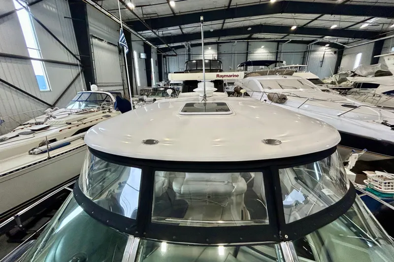  Yacht Photos Pics 2008 Sea Ray 44 Sundancer yacht in indoor storage, surrounded by other boats.