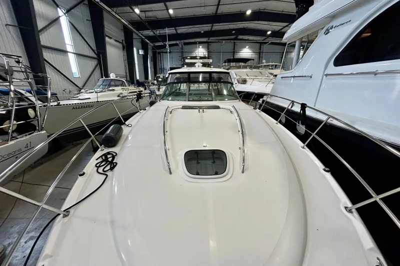  Yacht Photos Pics 2008 Sea Ray 44 Sundancer yacht in indoor storage, surrounded by other boats.