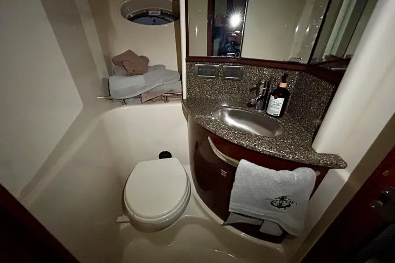  Yacht Photos Pics Luxurious bathroom in 2008 Sea Ray 44 Sundancer yacht with granite countertop and modern fixtures.