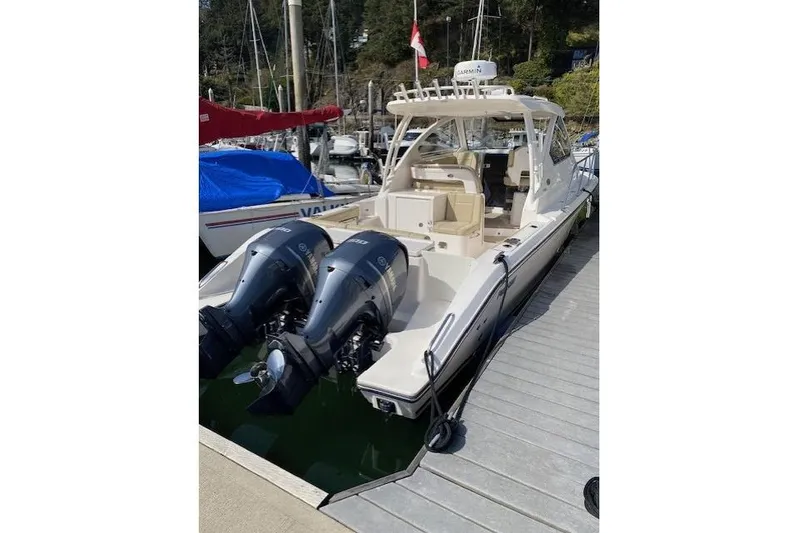 Syd Fishes Yacht Photos Pics 2017 Pursuit OS 325 Offshore boat docked with dual outboard engines.