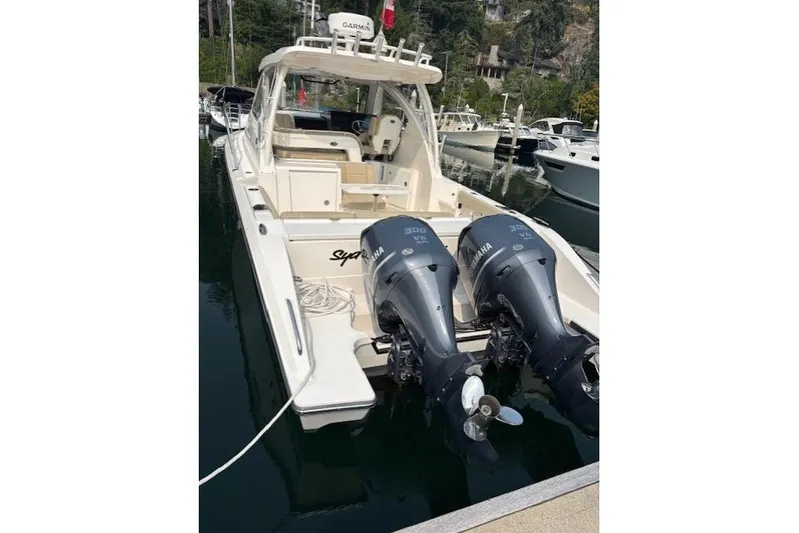 Syd Fishes Yacht Photos Pics 2017 Pursuit OS 325 Offshore boat with twin Yamaha engines docked at marina.