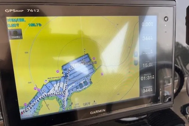 Syd Fishes Yacht Photos Pics Garmin GPS display on 2017 Pursuit OS 325 Offshore boat, showing navigation map.