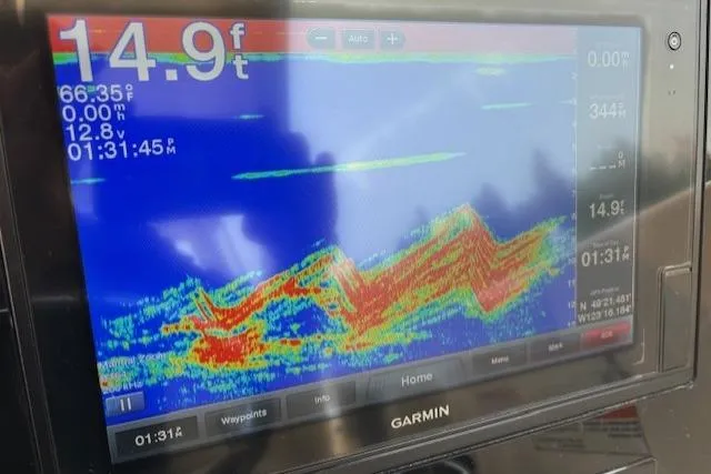 Syd Fishes Yacht Photos Pics Fishfinder display on 2017 Pursuit OS 325 Offshore, showing depth and underwater terrain.