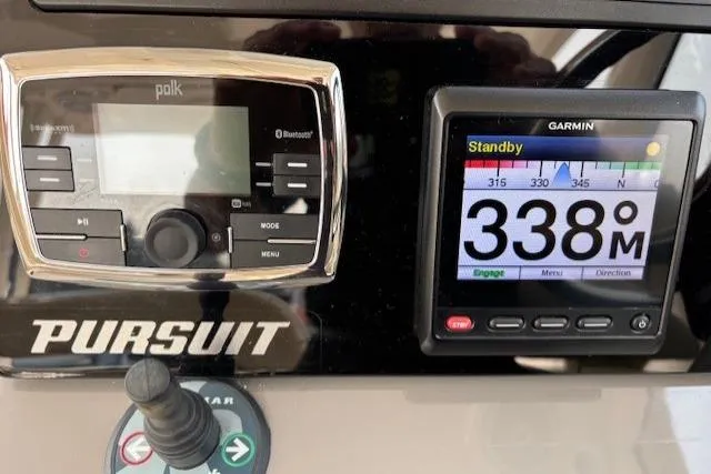 Syd Fishes Yacht Photos Pics Control panel of 2017 Pursuit OS 325 Offshore with Garmin and Polk displays.