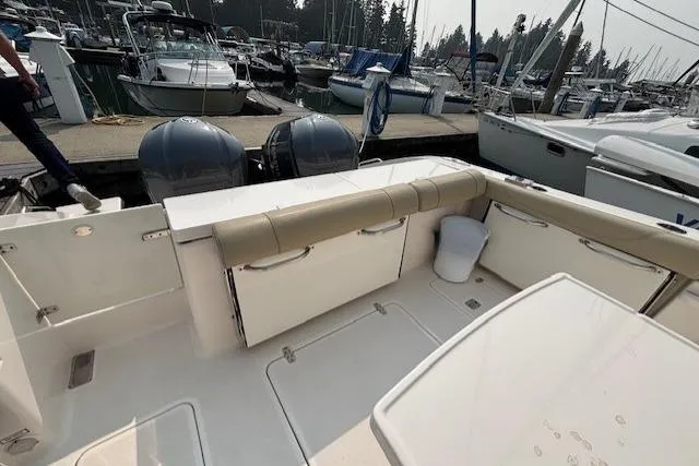 Syd Fishes Yacht Photos Pics 2017 Pursuit OS 325 Offshore boat interior at marina with twin engines.