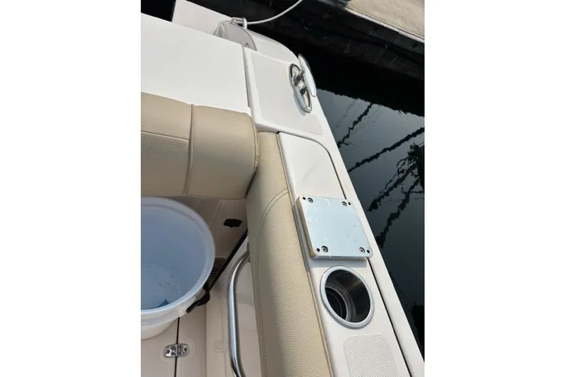 Syd Fishes Yacht Photos Pics 2017 Pursuit OS 325 Offshore boat interior with beige seating and cup holder.