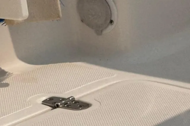 Syd Fishes Yacht Photos Pics 2017 Pursuit OS 325 Offshore boat deck with hinge detail.