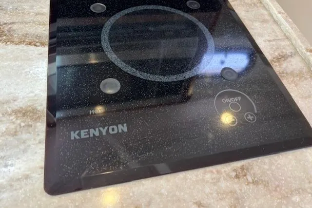 Syd Fishes Yacht Photos Pics Kenyon cooktop on 2017 Pursuit OS 325 Offshore boat's countertop.