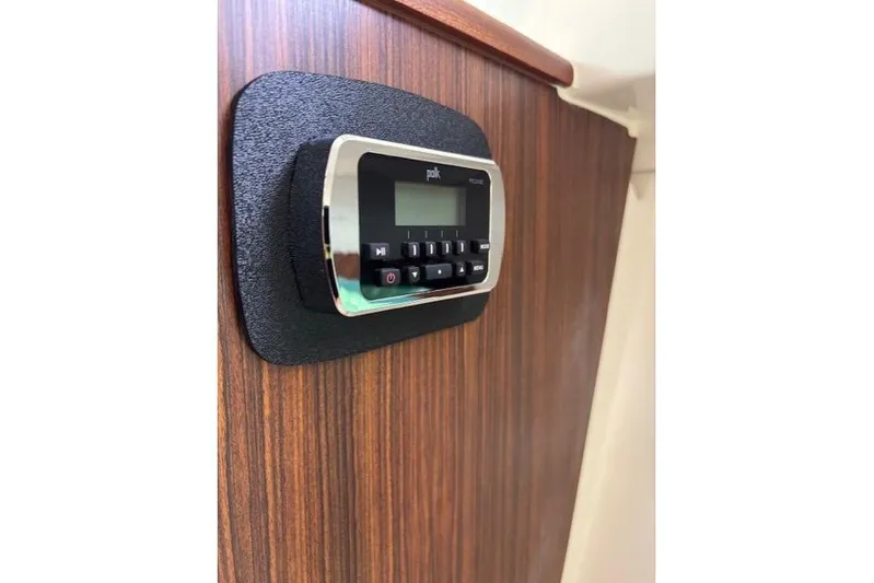 Syd Fishes Yacht Photos Pics Polk audio system on 2017 Pursuit OS 325 Offshore boat's wooden interior panel.