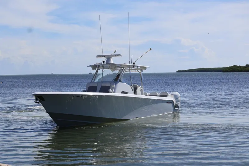  Yacht Photos Pics 2018 Contender 39 Fisharound boat on calm water under a clear sky.