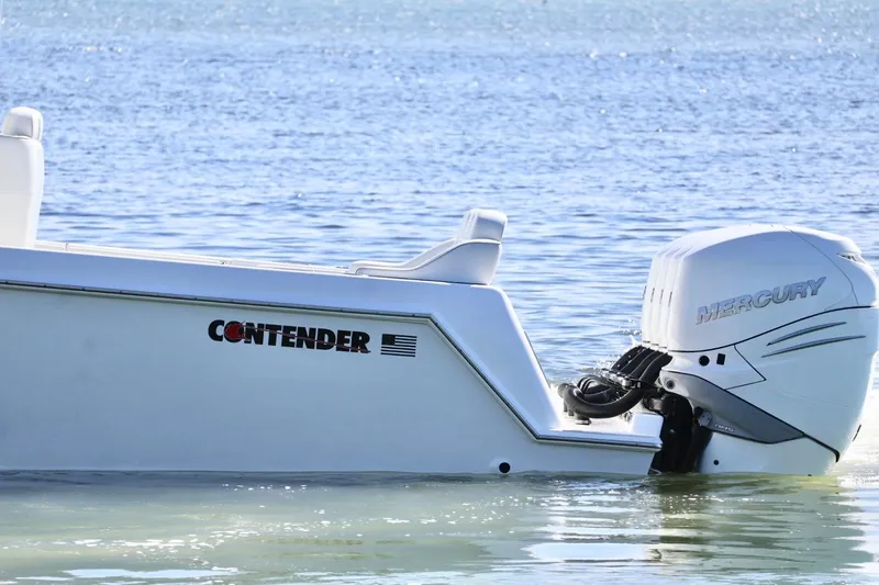 Yacht Photos Pics 2018 Contender 39 Fisharound boat with Mercury engine on calm water.