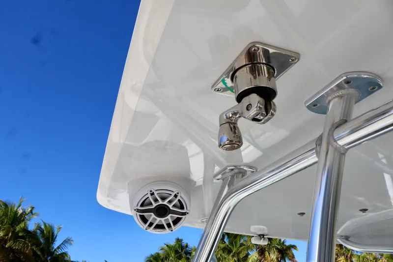  Yacht Photos Pics 2018 Contender 39 Fisharound boat detail with speaker and metal fixtures under clear blue sky.