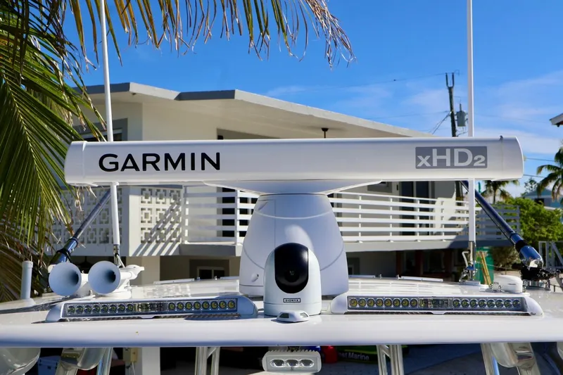  Yacht Photos Pics Garmin xHD2 radar on 2018 Contender 39 Fisharound boat, with palm trees and house background.