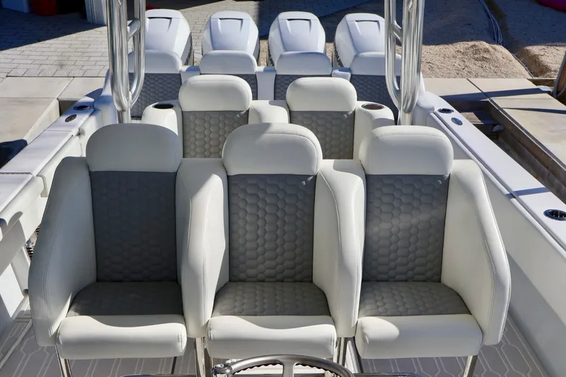  Yacht Photos Pics 2018 Contender 39 Fisharound boat with luxurious white and gray seating arrangement.