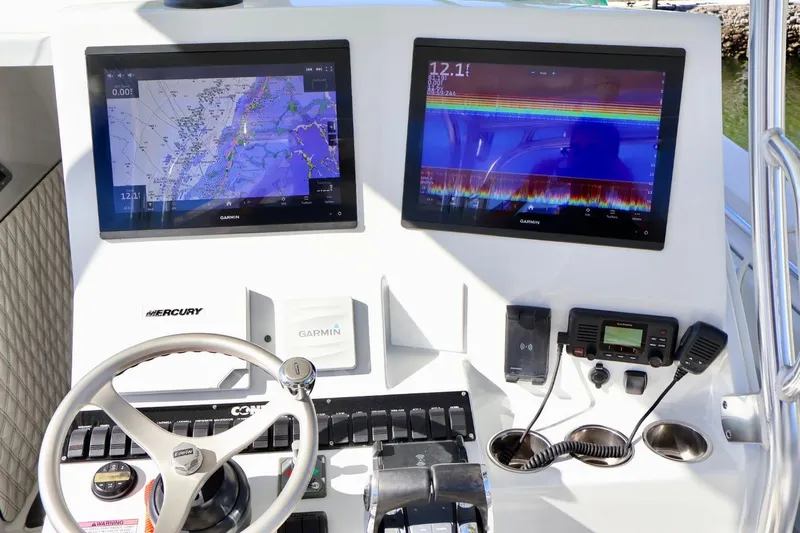  Yacht Photos Pics 2018 Contender 39 Fisharound dashboard with Garmin navigation and communication equipment.