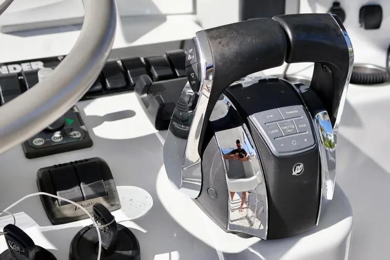  Yacht Photos Pics Close-up of 2018 Contender 39 Fisharound boat controls and steering wheel.
