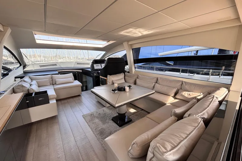  Yacht Photos Pics Luxurious interior of a 2019 Pershing 70 yacht with elegant seating and modern design.