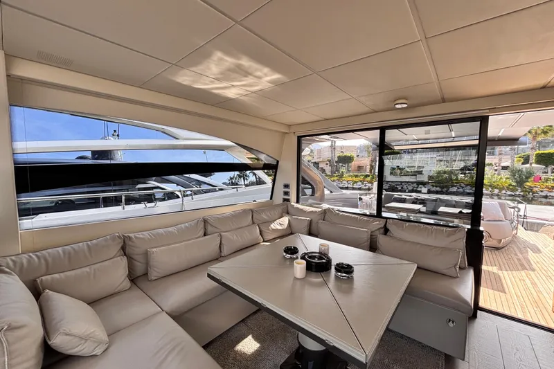  Yacht Photos Pics Luxurious interior of 2019 Pershing 70 yacht with plush seating and modern design.