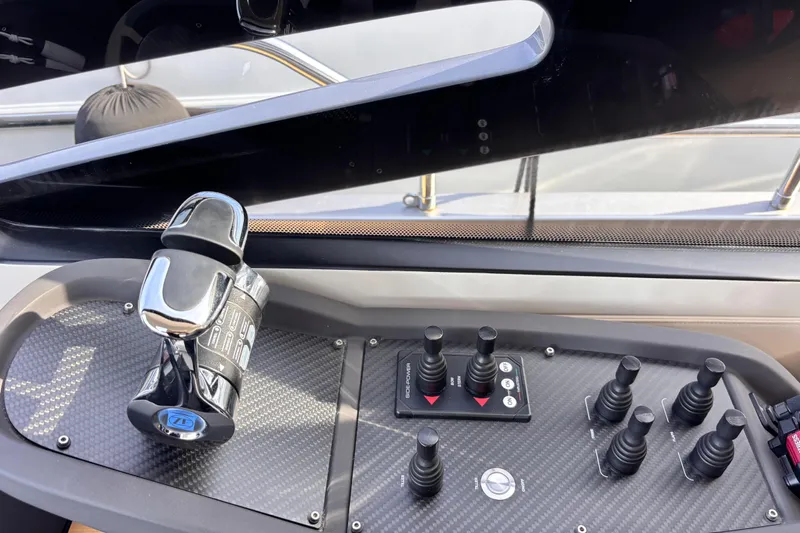  Yacht Photos Pics Control panel of a 2019 Pershing 70 yacht with throttle and joystick controls.