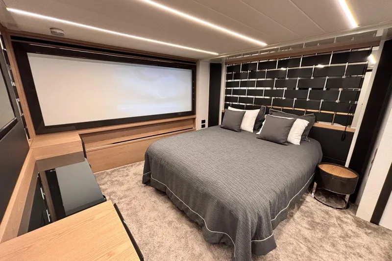  Yacht Photos Pics Luxurious bedroom interior of 2019 Pershing 70 yacht with modern design and elegant decor.