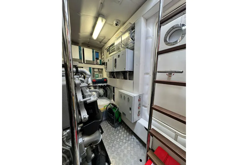 Yacht Photos Pics Engine room of 2019 Pershing 70 yacht with machinery and control panels.