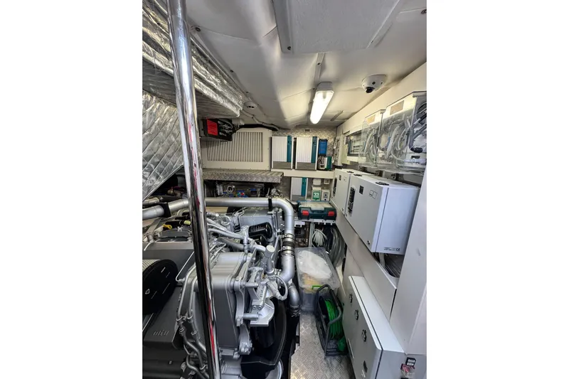  Yacht Photos Pics Engine room of a 2019 Pershing 70 yacht, showcasing machinery and equipment.