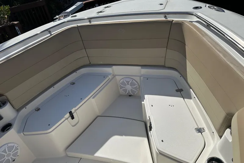  Yacht Photos Pics 2019 Sailfish 360 CC boat interior with cushioned seating and storage compartments.