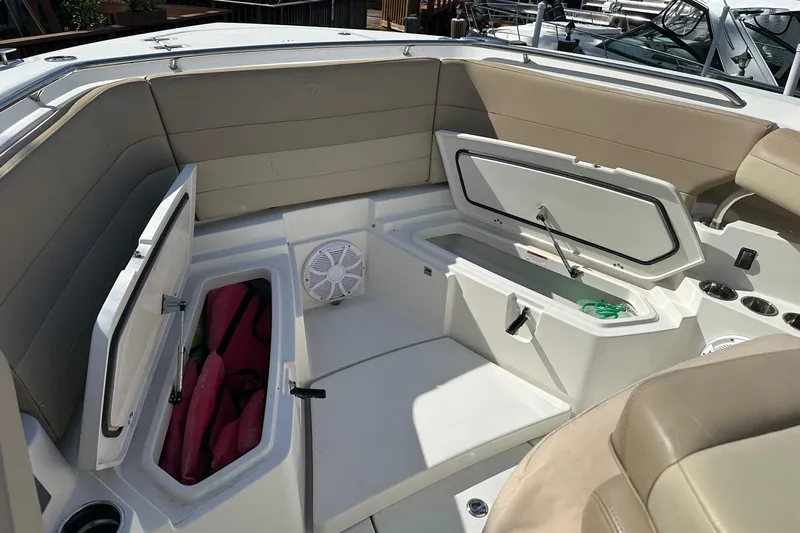  Yacht Photos Pics 2019 Sailfish 360 CC boat interior with open storage compartments and seating.