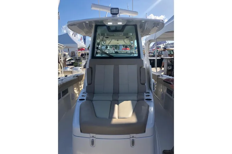  Yacht Photos Pics 2019 Sailfish 360 CC boat interior with cushioned seating and modern design.