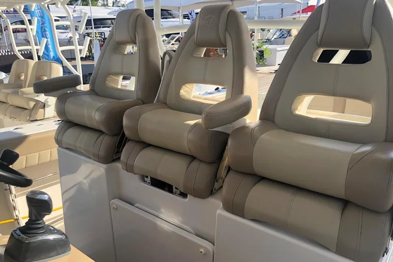  Yacht Photos Pics 2019 Sailfish 360 CC boat with luxurious beige seating and modern controls.