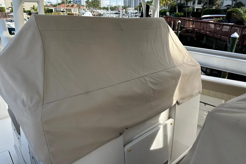  Yacht Photos Pics Covered console of a 2019 Sailfish 360 CC boat docked at a marina.